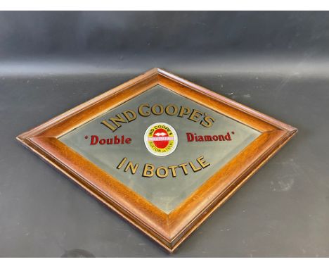 An Ind Coope's 'Double Diamond' In Bottle lozenge shaped advertising mirror, 28 1/2 x 23".