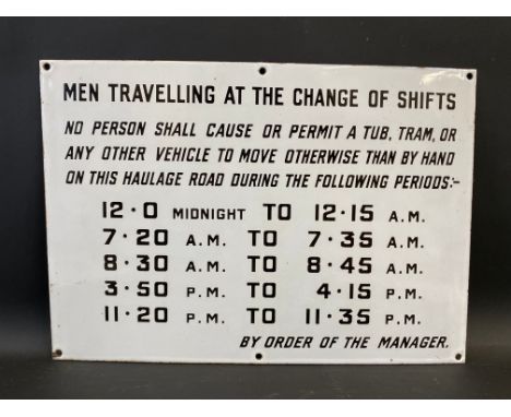 An enamel sign in near mint condition instructing 'Men travelling at the change of shifts', 20 x 14".