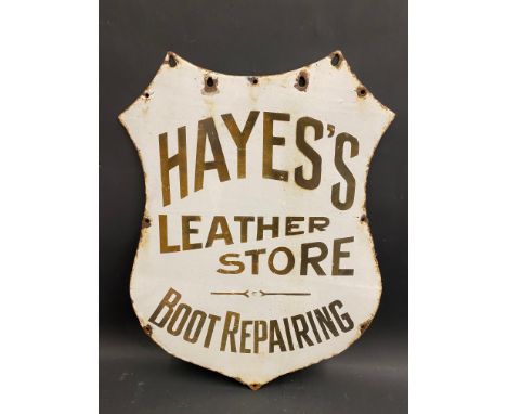 A Hayes's Leather Store 'Boot Repairing' shield shaped enamel sign, 18 x 24".