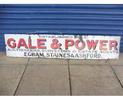 A rectangular enamel sign advertising Gale &amp; Power, Auctioneers, Surveyors and Estate Agents of Egham, Staines and Ashfor