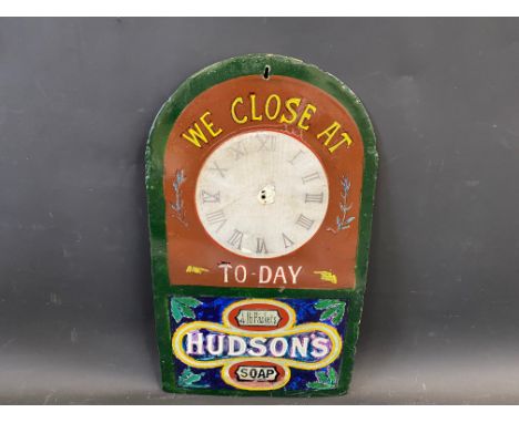 A Hudson's Soap 'We Close At..To-Day' enamel clock sign, heavily restored, 10 1/2 x 18".