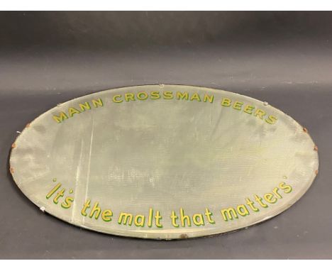A Mann Crossman Beers oval advertising mirror, 28 x 18".