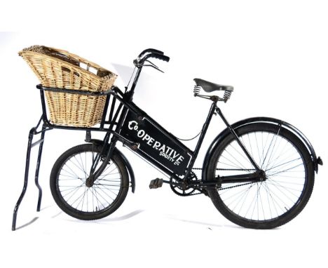 A Vintage CWS Co-op Society Delivery Bike, with repainted black frame and Dunlop sprung seat, with mud guards, folding stand 