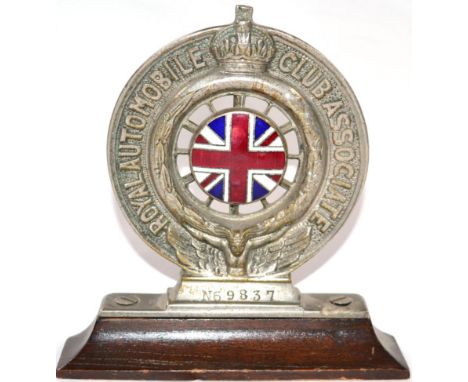 A 1930s Nickel and Enamel RAC Badge, N69837, the verso stamped D B Collins Ltd, mounted on a moulded wooden base, 10cm high