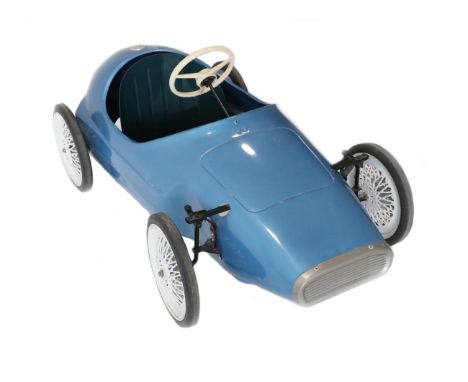 A Triang Vintage Pedal Car modelled as a 1960's Grand Prix Racing Car, painted blue with green bucket seat and plastic three-