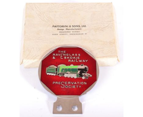 A Polished Chrome and Enamel Car Badge, The Ravenglass and Eskdale Railway Preservation Society, with paper tissue, contained