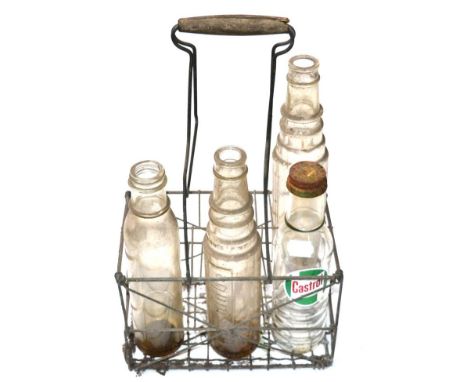 A Vintage Six Bottle Oil Crate, with wooden handle, with Castrol Motoroil glass bottle with original lid, two Essolube 1 pint