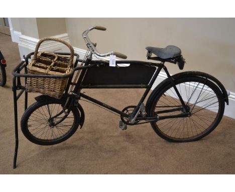 A Vintage 1950s Raleigh Delivery Bike, with repainted black frame and Dunlop sprung seat, with mud guards, folding stand and 