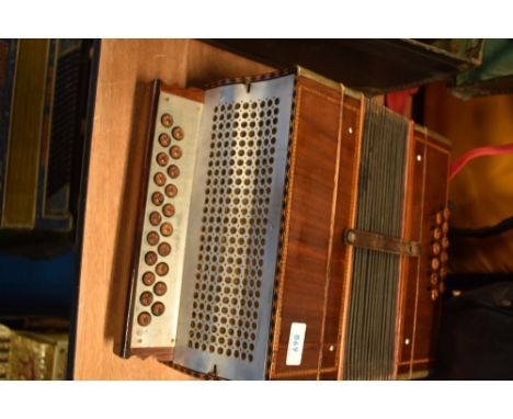 A vintage wooden cased button accordion , sold with later accordion case (German)