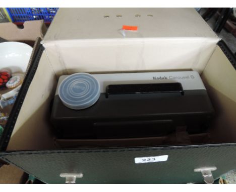 A Kodak Carousel S slide projector and six carousels