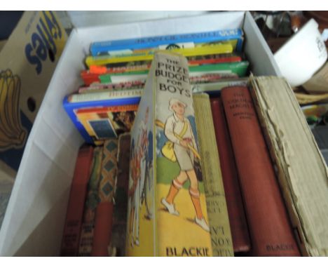 A box of various vintage childrens annuals and story books