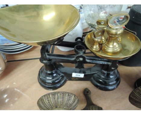A set of vintage kitchen scales and weights