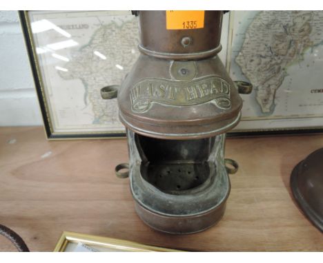 A vintage copper ships light with brass name tag reading 'Mast Head'