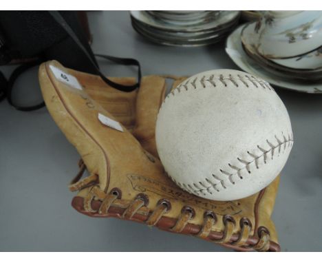 A vintage leather baseball glove with ball possibly San Francisco Giants 