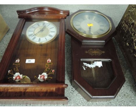 Two modern electric wall clocks with wooden body's in a vintage style