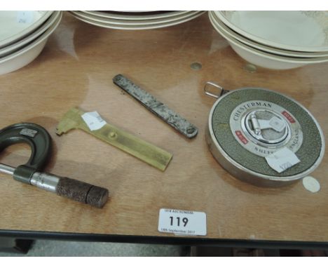 A selection of engineers measuring tools including micrometer, gauges and vintage Chesterman 50ft tape measure
