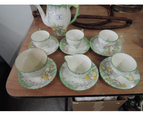 A Delphine part tea service with hand painted and enamel floral design reg. No. 788803