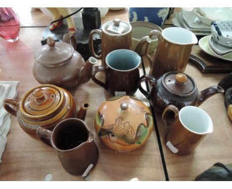 A selection of various ceramic jugs and tea pots including Royal Worcester and Sadlers etc