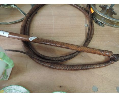 A genuine vintage Indianna Jones style 8ft long leather bound bull whip