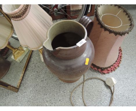 A salt glazed jug an onyx and gilt table lamp and extra shade