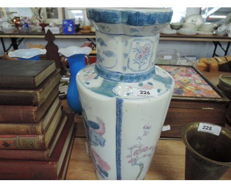 A large ceramic vase with asiatic pheasant design