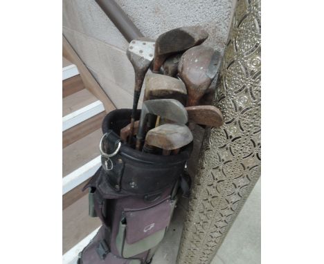A selection of vintage golf clubs including hickory shafted