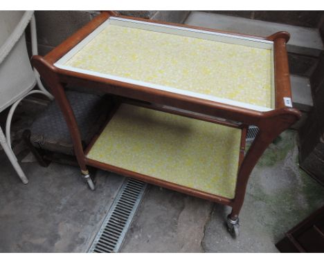 A vintage wooden and melamine tea trolley 