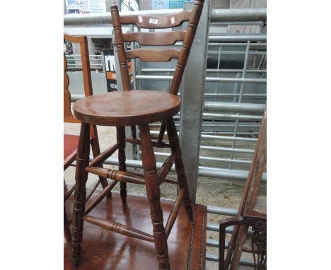 A vintage wooden breakfast stool