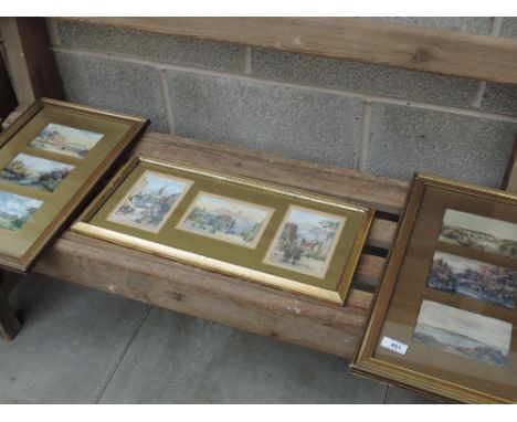 A selection of framed vintage postcards