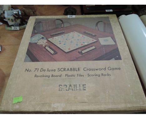 A vintage No71 Scrabble set, with Braille tiles and revolving board, in original box