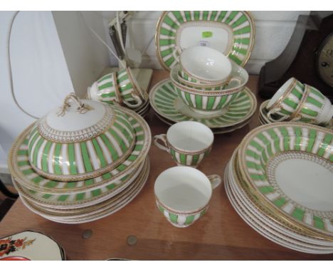 A vintage tea service in green and gilt on a white ground, approx 34 pieces