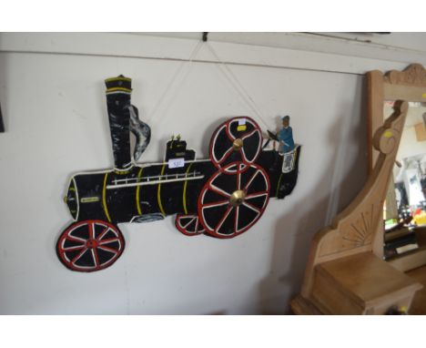 A cut out tin traction engine model
