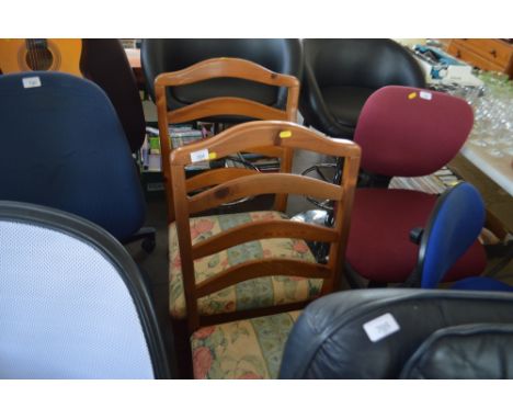 A pair of pine ladder back dining chairs 
