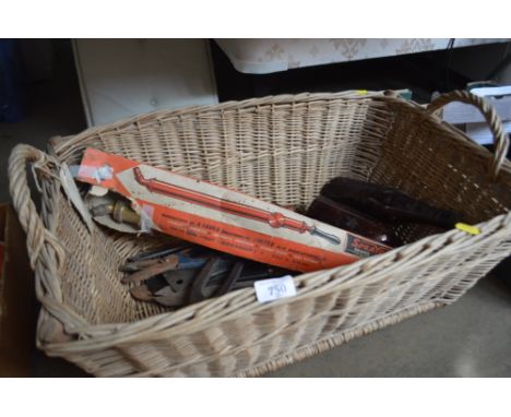 A wicker basket of various tools; a brass syringe; glass bottles etc.