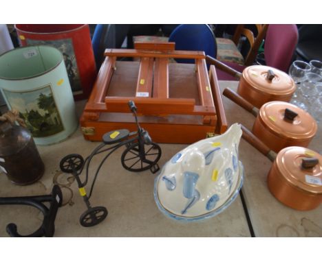 An artist's easel; small model tricycle and an egg tureen 