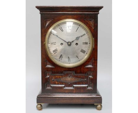 An Oak Striking Mantel Clock, early 20th century, retailed by Maple &amp; Co. London, 7" silvered dial, twin fusee movement w