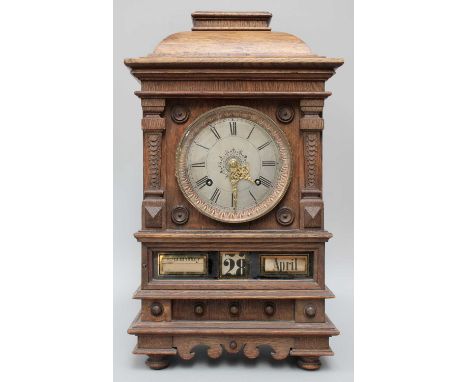 A German Oak Cased Striking Mantel Clock, with an unusual triple calendar displayNo signs of any missing parts