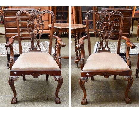 A Set of Four Reproduction Mahogany Ribband Back Carver Armchairs, in Chippendale style, with outswept arms, drop in seats an