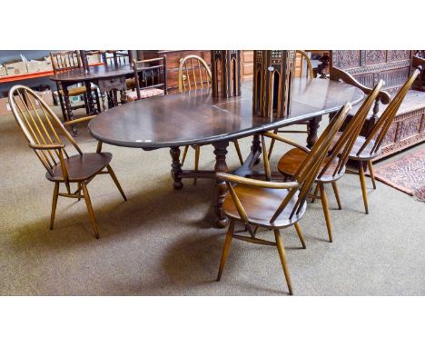 An Ercol Extending Dining Table, 212cm (open) by 107cm by 72cm, on turned supports with x-form cross stretcher, together with