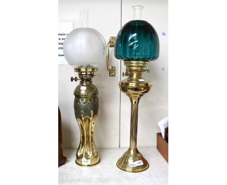 A Trench Art Brass-Based Oil Lamp, together with a similar brass-based oil lamp with emerald green glass shade (2)