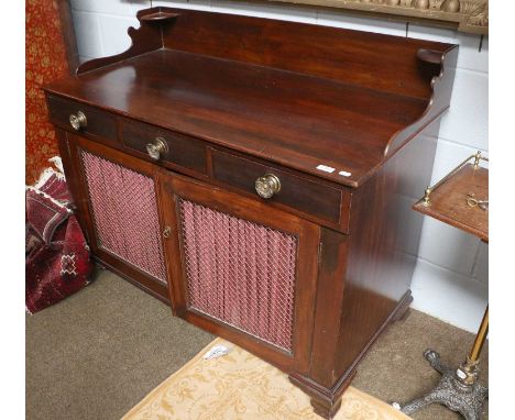 A 19th Century Mahogany Chiffonier, shaped gallery back above three short drawers and a pair of gilt-metal grille doors, all 