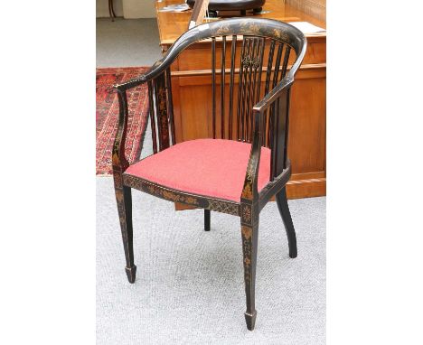 A Chinoiserie Lacquered Stick Back Armchair, with upholstered seat and on square taperin supports terminating on spade feet