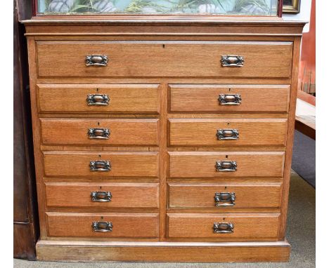 An Edwardian Light Oak Straight Fronted Chest of Drawers, with unusual arrangement of one long over two banks of five short d