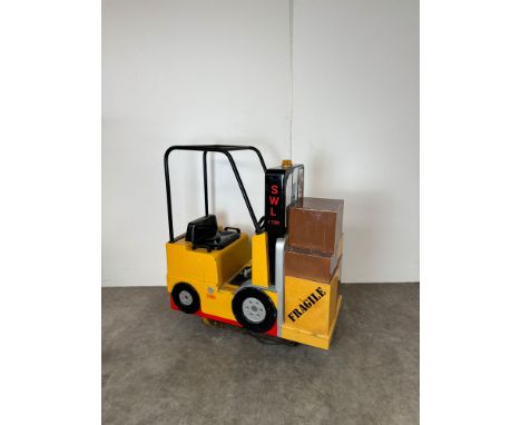 2004 Jolly Roger Forklift Truck Kiddie Ride. The ride rocks back and forth while playing forklift sounds and features a butto