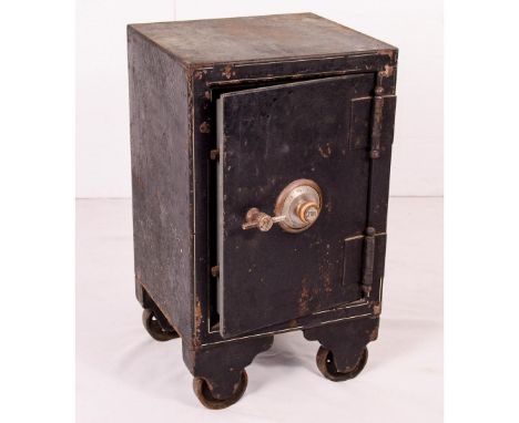 Small vintage Yale fireproof combination safe on wheels. Has 1 fixed shelf inside. Missing inside of door cover plate. With c