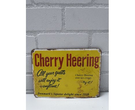 Cherry Heering liqueur enamel sign. Overall fair condition, wear and enamel loss on edges and on some additional spots. Dimen