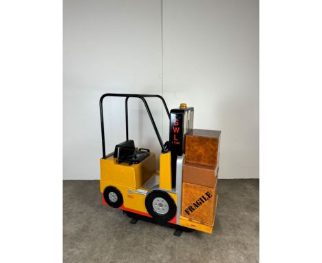 2004 Jolly Roger Forklift Truck Kiddie Ride. The ride rocks back and forth while playing forklift sounds and features a butto