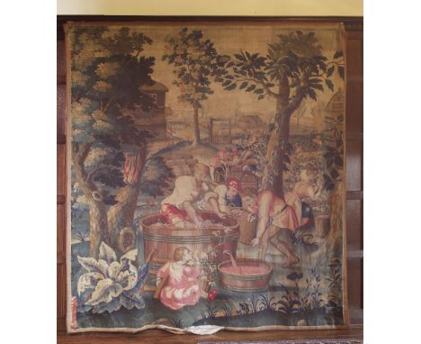 A tapestry panel, emblematic of autumn,late 17th century, Mortlake or Hatton Garden, London, woven with a vineyard scene in v