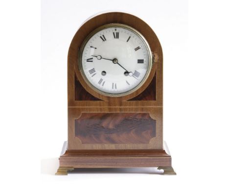 An Edwardian strung mahogany mantel clock,with an enamel dial and French movement striking on a gong, the sides with pierced 