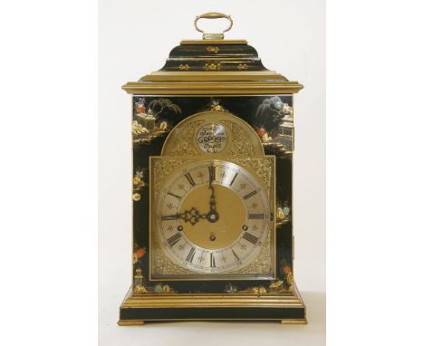 A reproduction black lacquered bracket clock,in the 18th century style, signed 'F.W. Elliott', with an arched brass dial and 